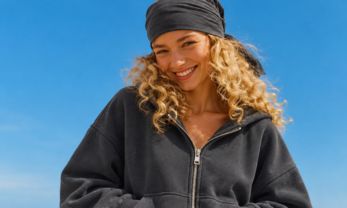Woman in a dark grey French Terry zip up